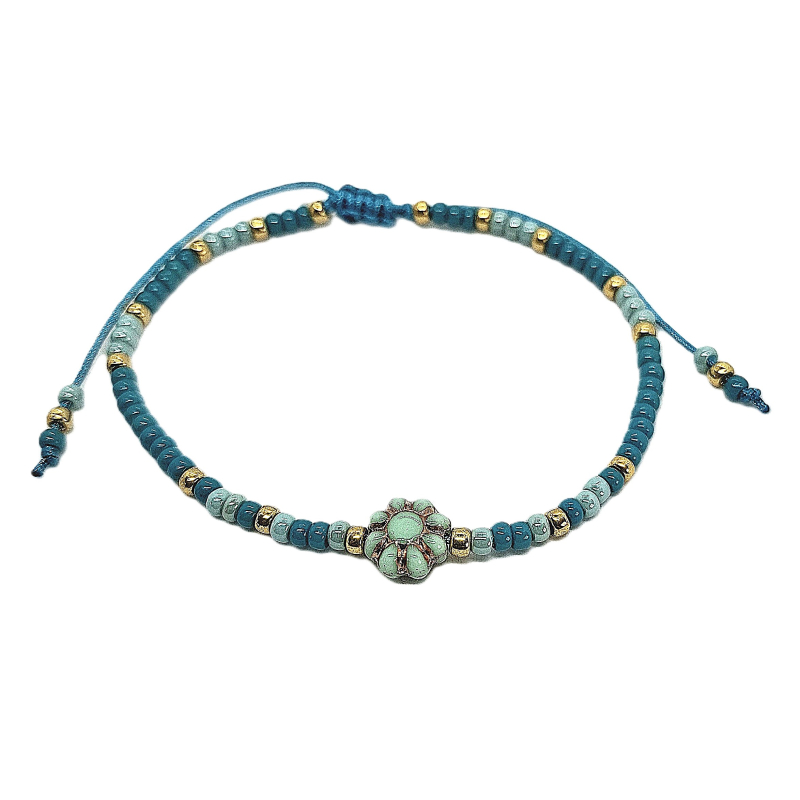 petrol blauw schuifarmbandje met bloem